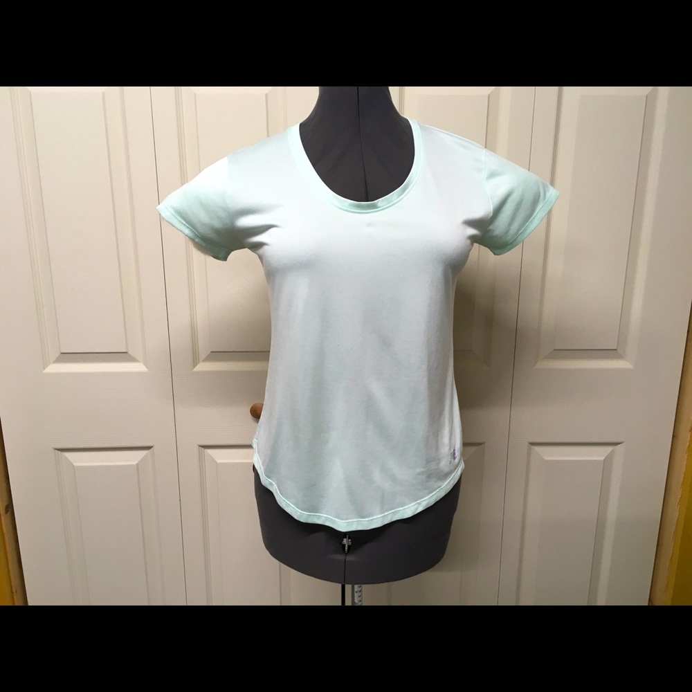 Mint green New Balance workout shirt.